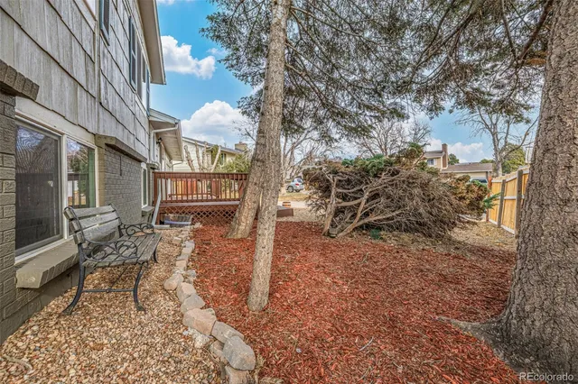 a view of a kitchen with a refrigerator and a stove top oven
