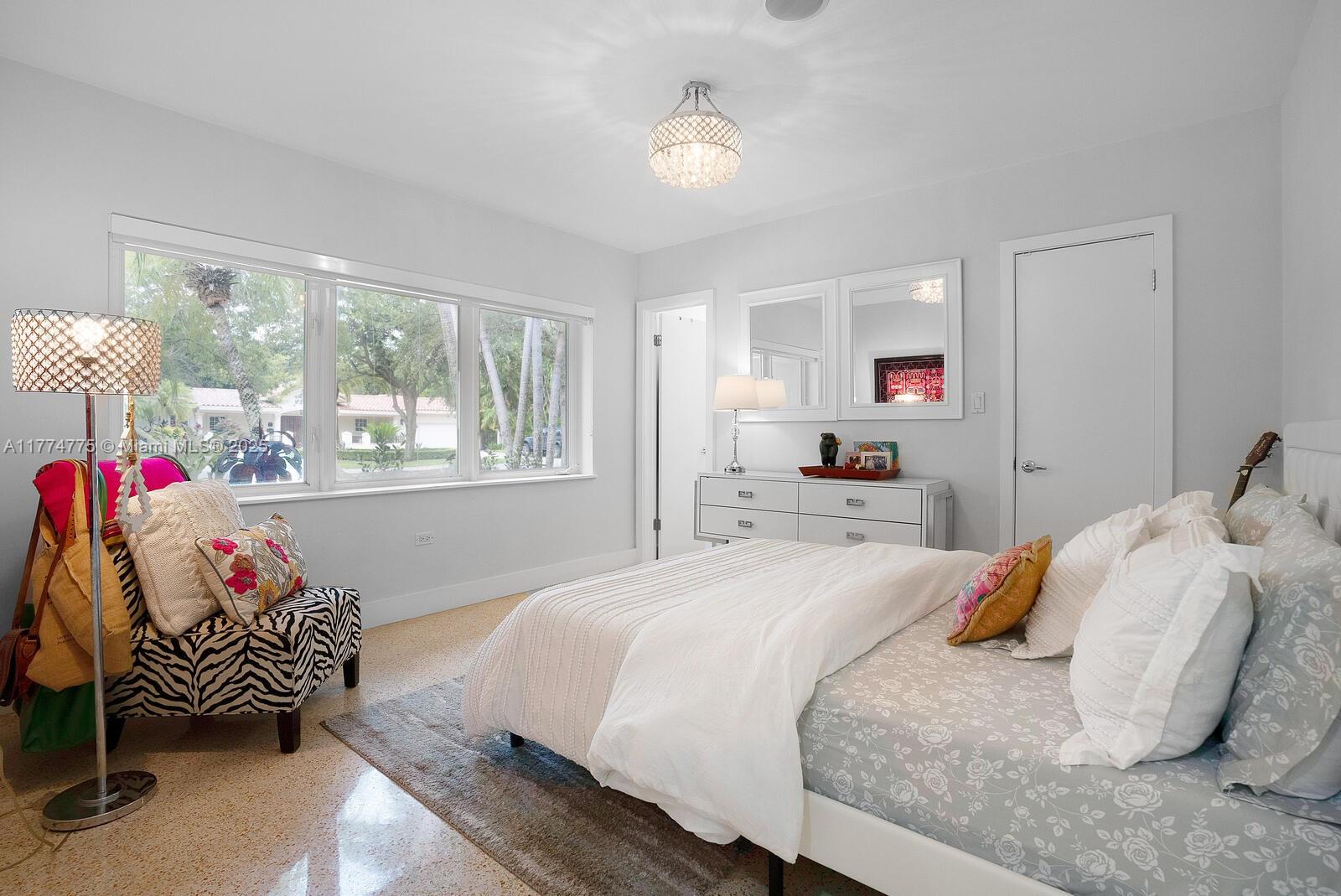 1523 Blue Road Coral Gables, FL 33146 - Photo 11 of 26 a bedroom with a bed and window