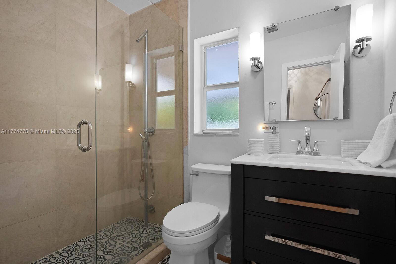 1523 Blue Road Coral Gables, FL 33146 - Photo 15 of 26 a bathroom with a sink toilet and shower