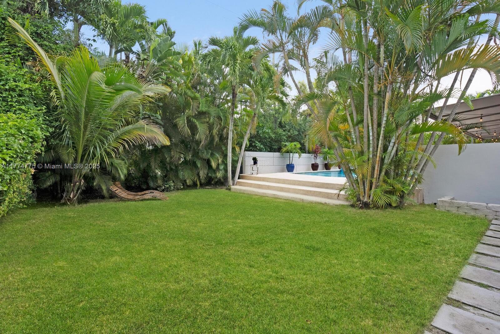 1523 Blue Road Coral Gables, FL 33146 - Photo 22 of 26 a view of green field with sitting area