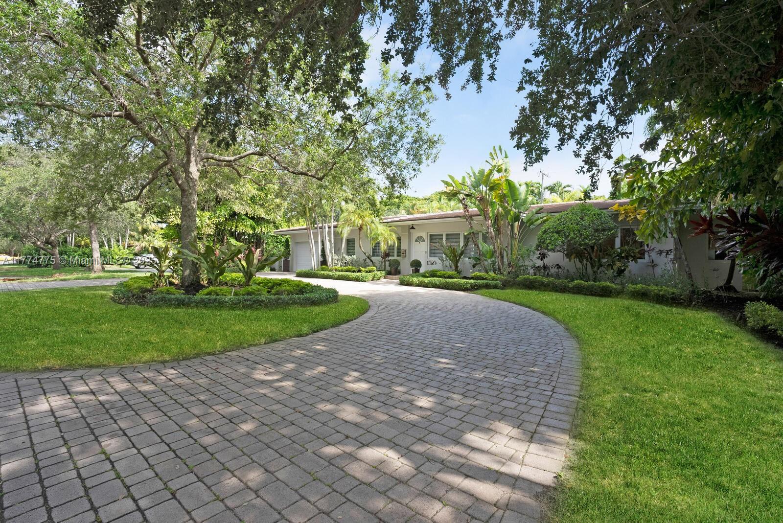 1523 Blue Road Coral Gables, FL 33146 - Photo 3 of 26 a view of a park with large trees