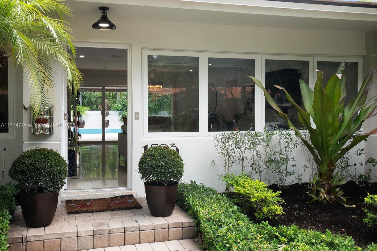 1523 Blue Road Coral Gables, FL 33146 - Photo 4 of 26 a view of a entryway door front of house