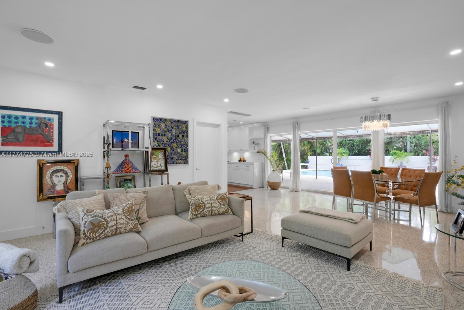1523 Blue Road Coral Gables, FL 33146 - Photo 7 of 26 a living room with furniture and a large window