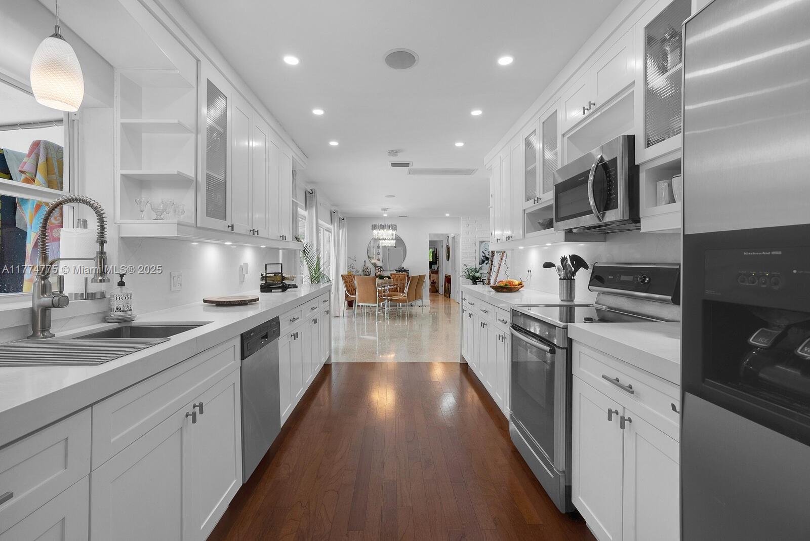 1523 Blue Road Coral Gables, FL 33146 - Photo 10 of 26 a large kitchen with stainless steel appliances lots of counter top space