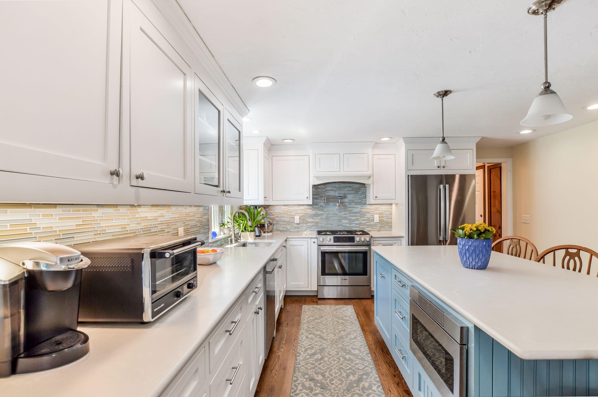 290 Cotuit Bay Drive Cotuit, MA 02635 - Photo 17 of 55 a kitchen with a stove sink and cabinets