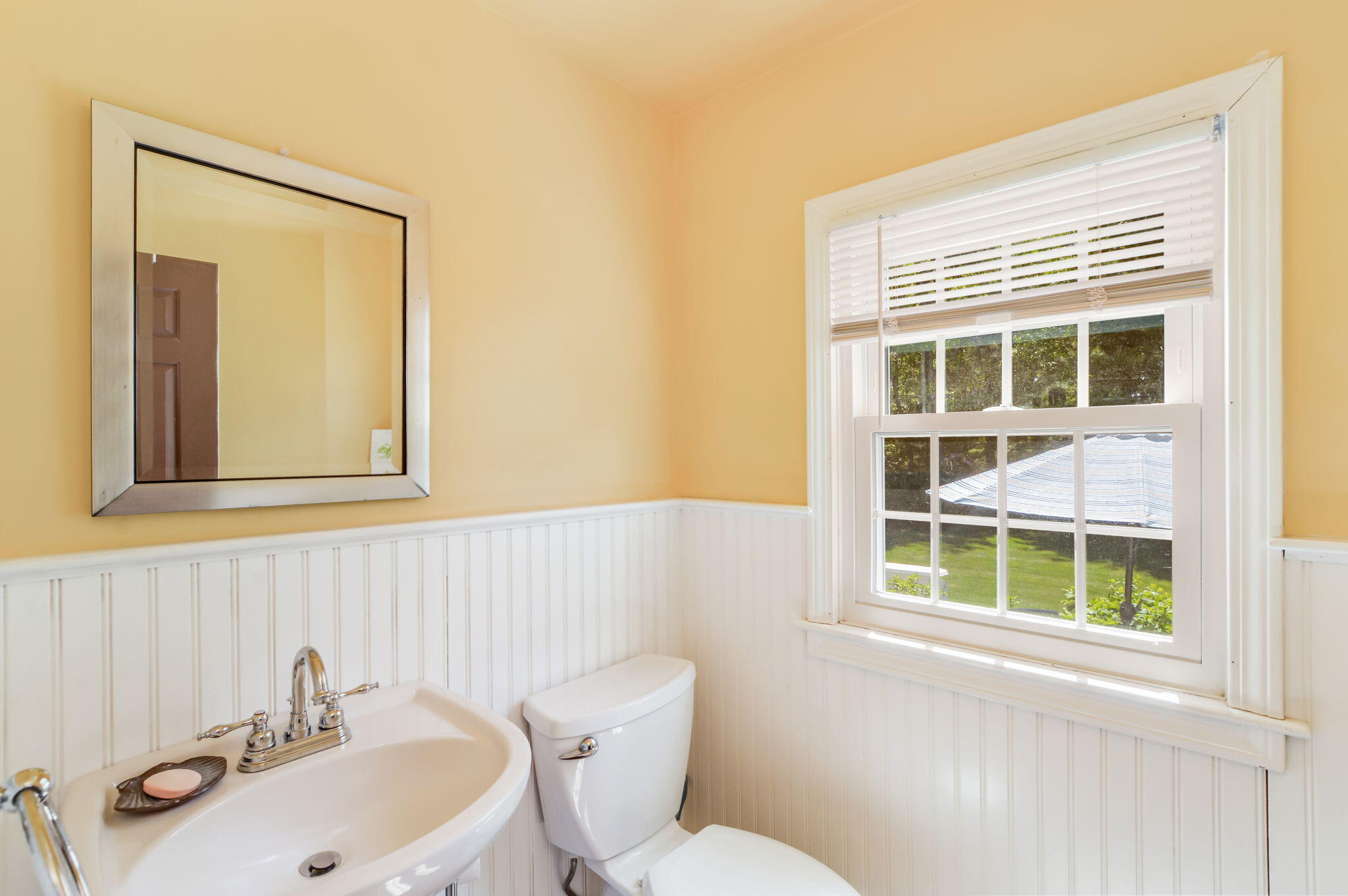 290 Cotuit Bay Drive Cotuit, MA 02635 - Photo 19 of 55 a bathroom with a sink a toilet and a mirror