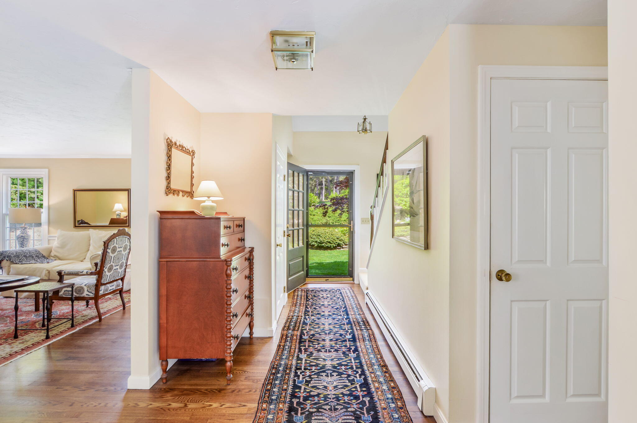290 Cotuit Bay Drive Cotuit, MA 02635 - Photo 20 of 55 a view of a hallway with furniture and wooden floor