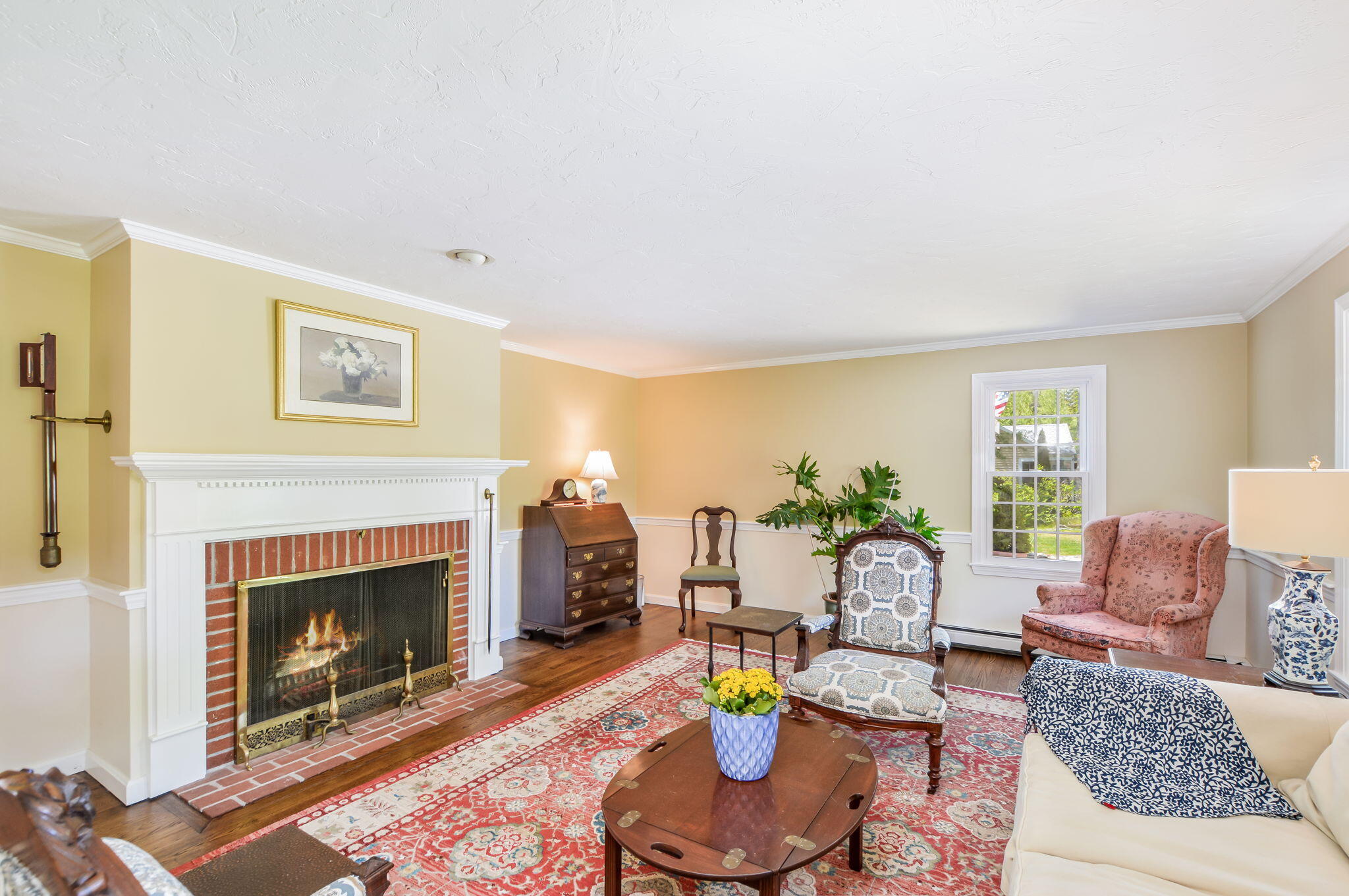 290 Cotuit Bay Drive Cotuit, MA 02635 - Photo 21 of 55 a living room with furniture a window and a fireplace