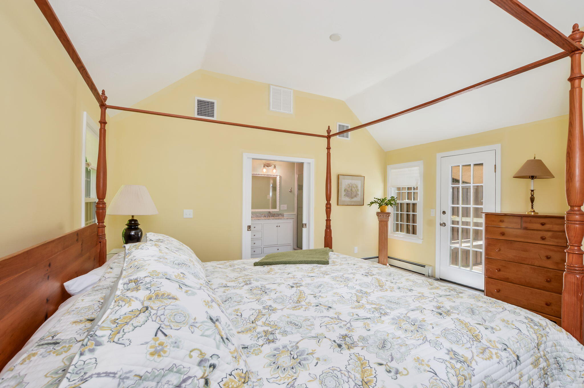 290 Cotuit Bay Drive Cotuit, MA 02635 - Photo 25 of 55 a bedroom with a large bed and wooden floor