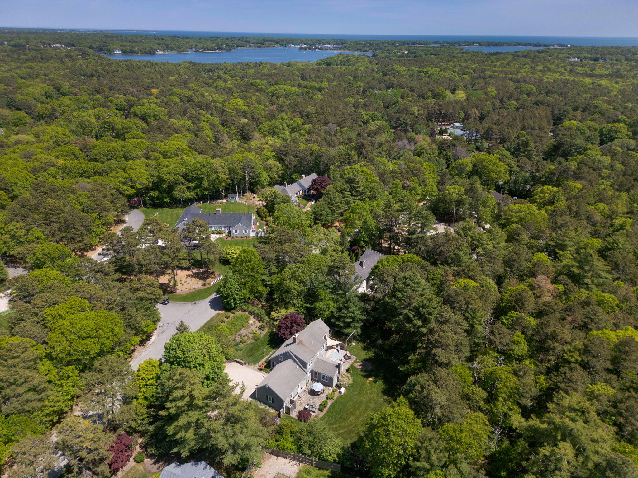 290 Cotuit Bay Drive Cotuit, MA 02635 - Photo 3 of 55 an aerial view of residential houses with outdoor space and trees