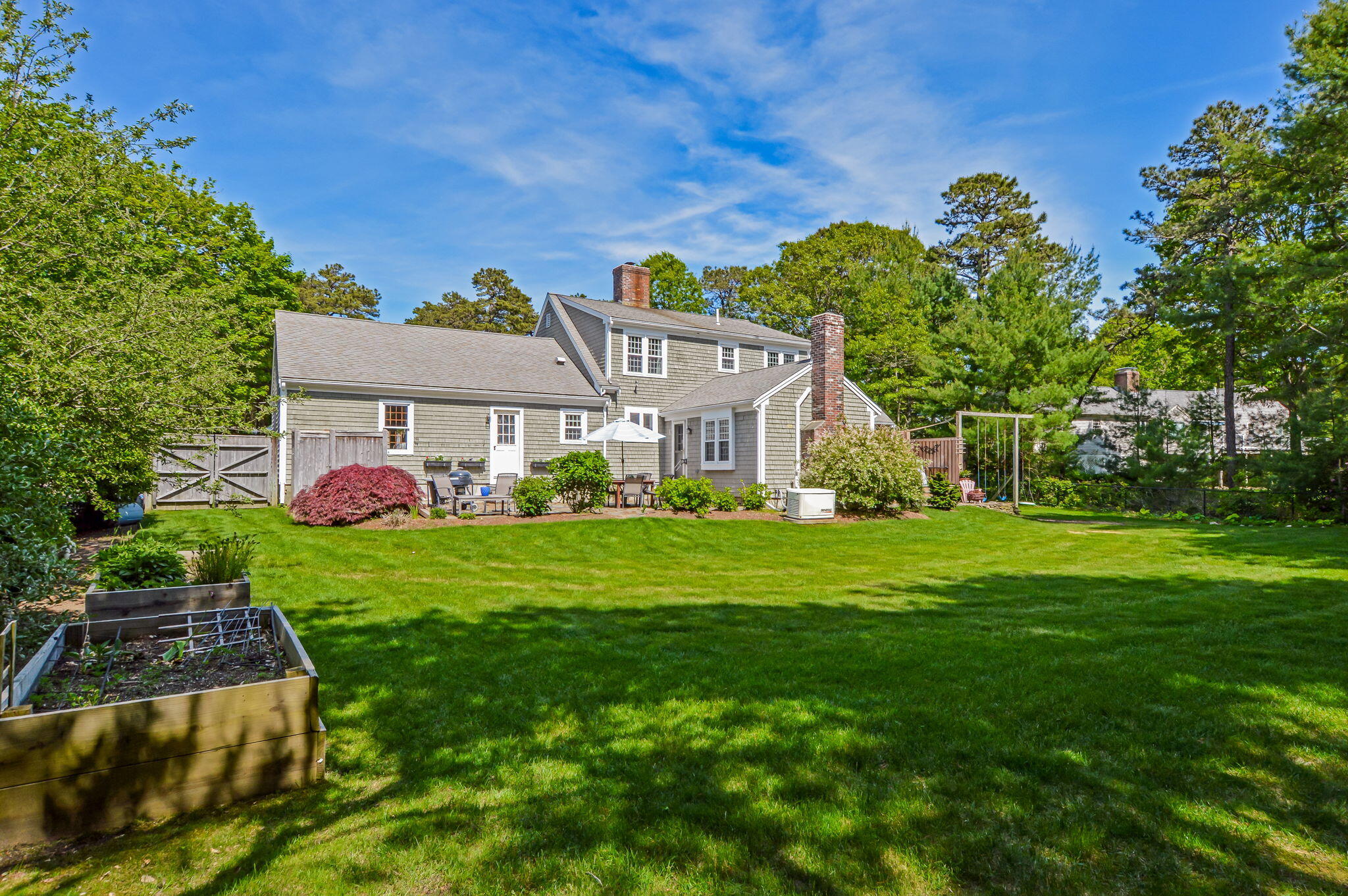 290 Cotuit Bay Drive Cotuit, MA 02635 - Photo 36 of 55 a front view of a house with garden