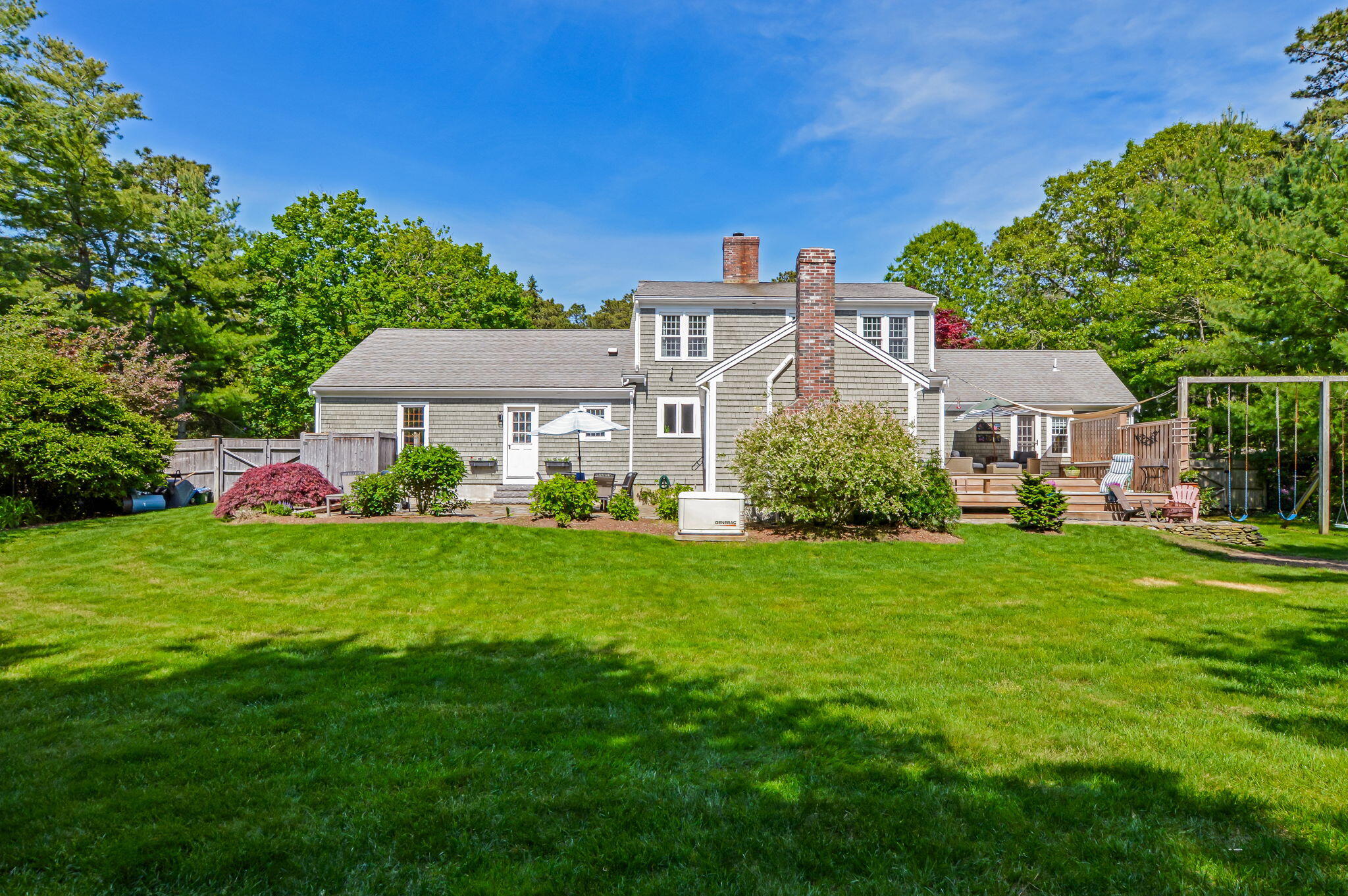 290 Cotuit Bay Drive Cotuit, MA 02635 - Photo 37 of 55 a front view of a house with a garden