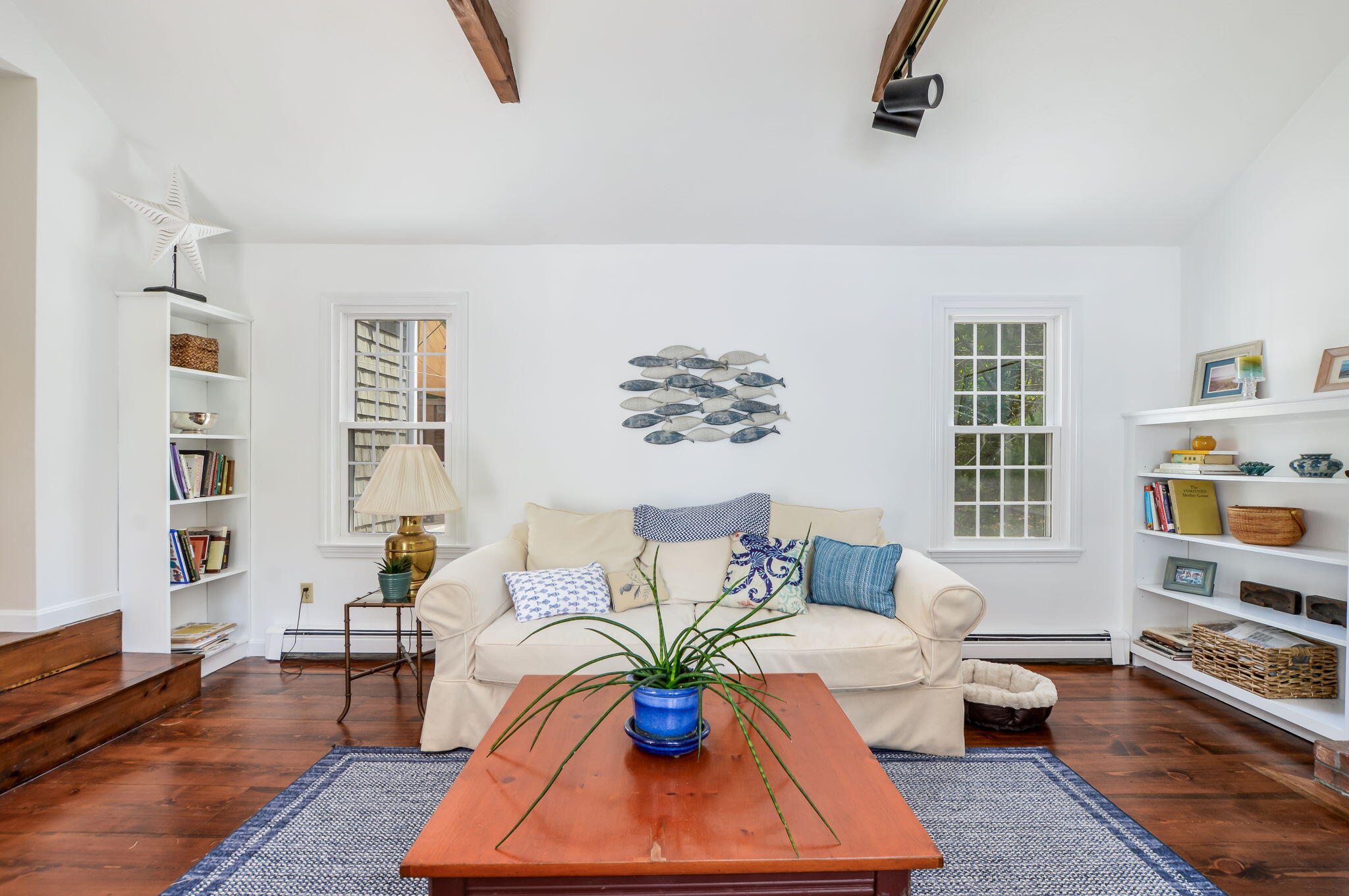 290 Cotuit Bay Drive Cotuit, MA 02635 - Photo 7 of 55 a living room with furniture lamp and book shelf