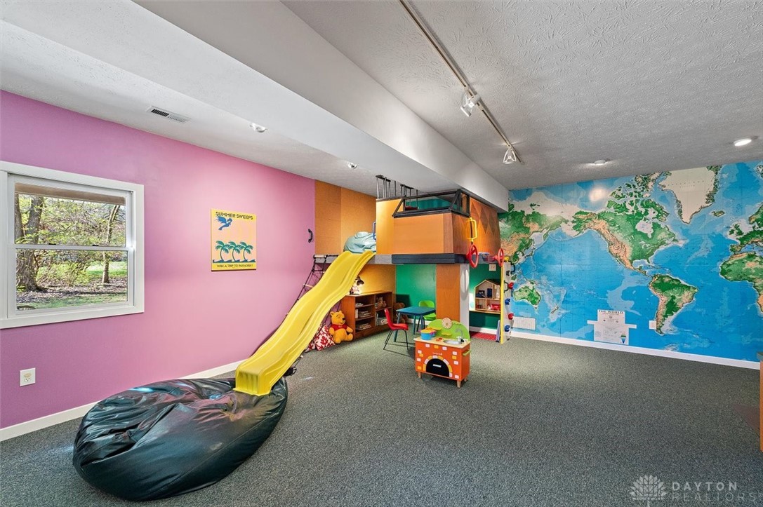 367 Timberleaf Drive Beavercreek, OH 45430 - Photo 55 of 72 This was the ping pong area but when the grand kids came the fun began...rope laddar, rock wall and slide...let the games begin