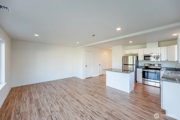 a view of kitchen with wooden floor