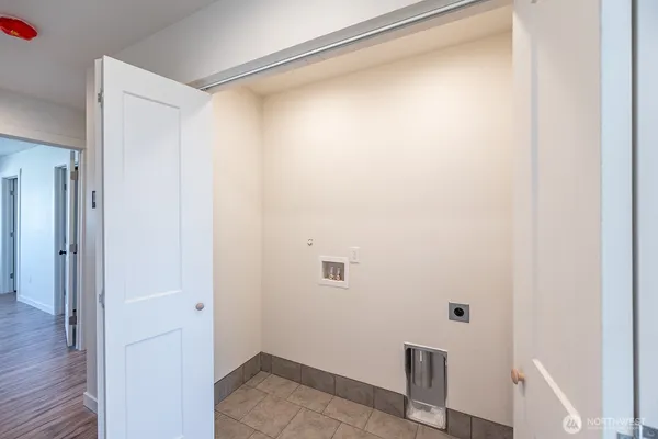 a bathroom with a granite countertop sink a toilet a mirror and shower