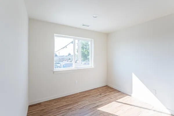 a view of hallway with wooden floor