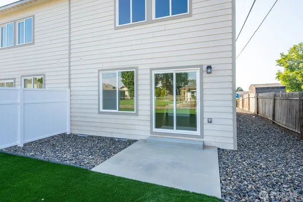 a view of house with backyard and garden