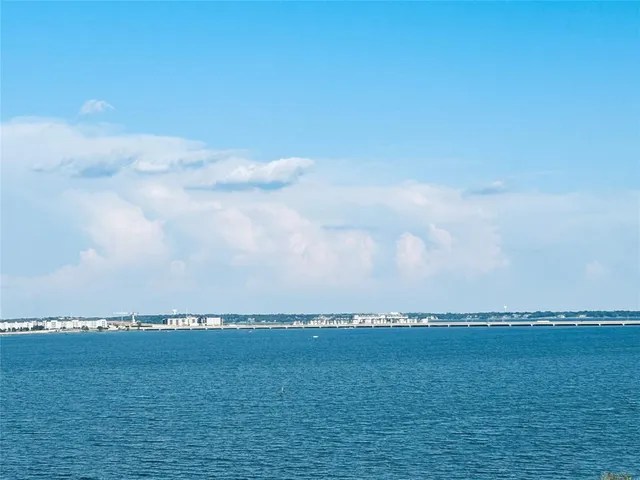 a view of an ocean and mountain