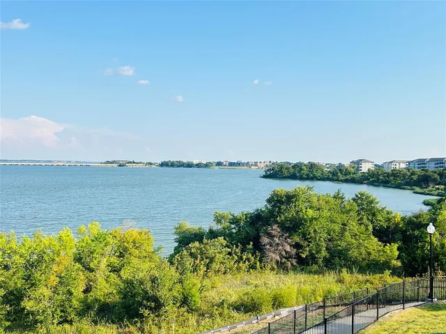 a view of a lake with a city