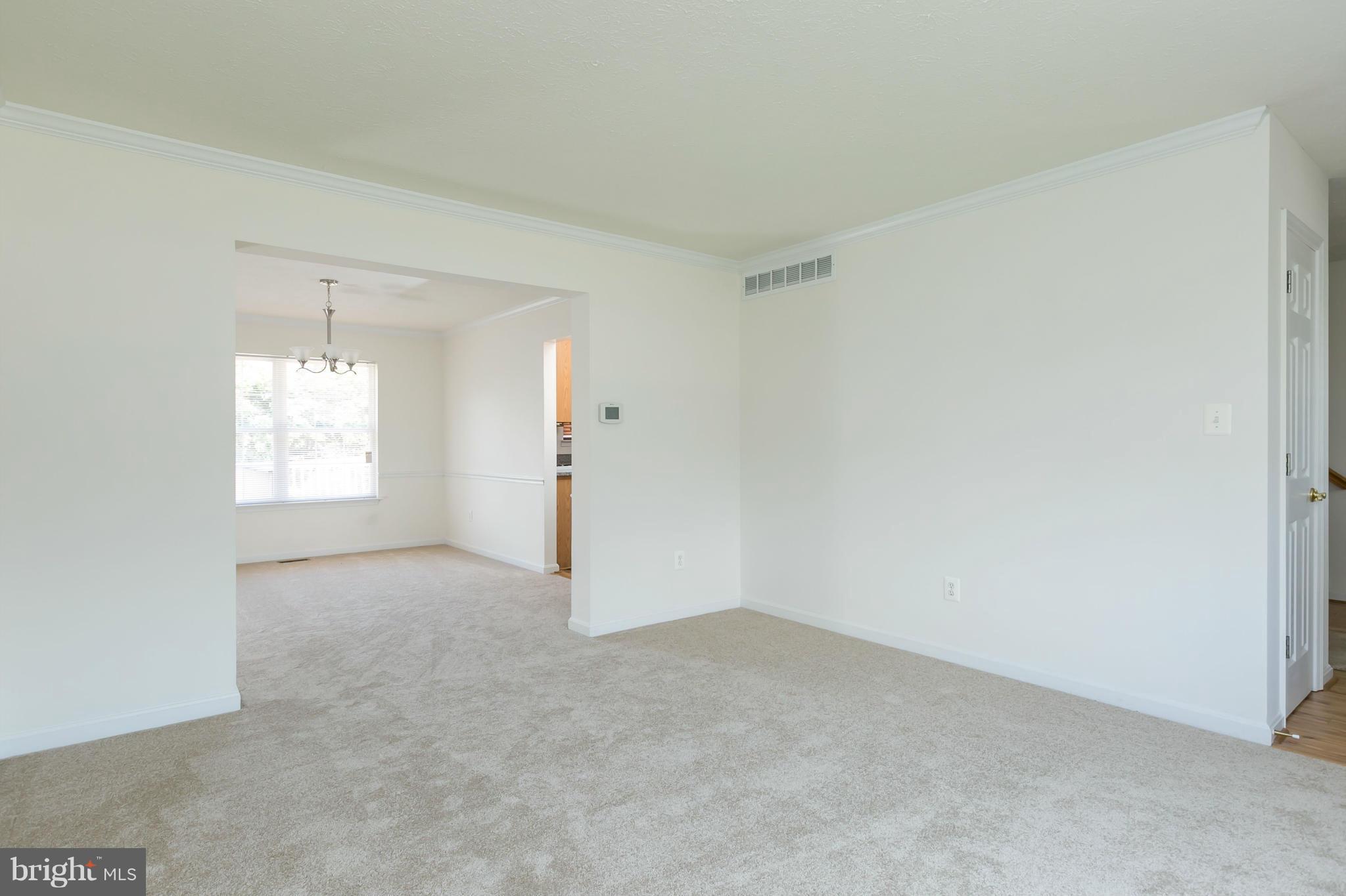 9302 Sea Point Road Baltimore, MD 21219 - Photo 4 of 30 an empty room with windows and cabinet