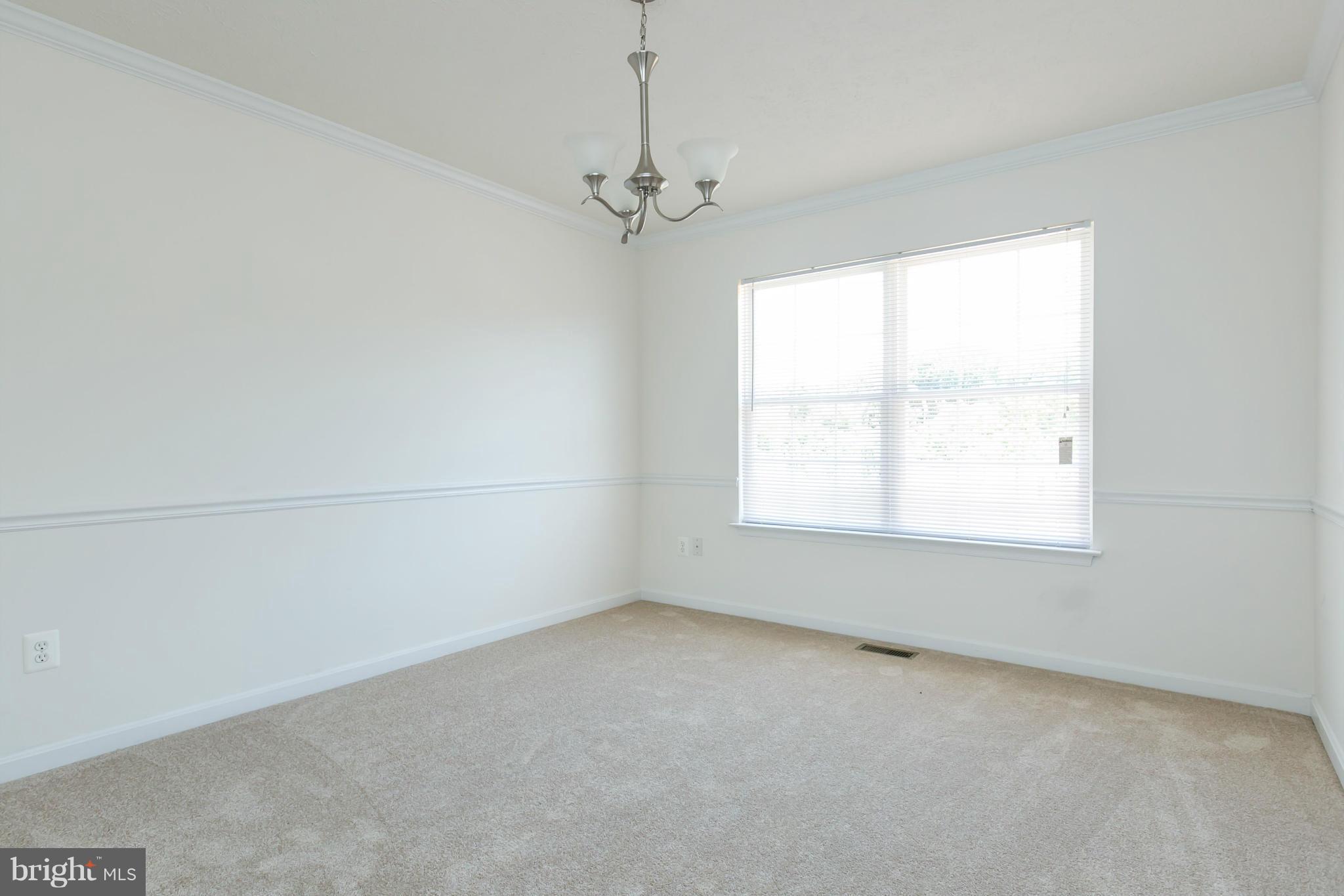 9302 Sea Point Road Baltimore, MD 21219 - Photo 6 of 30 an empty room with a window