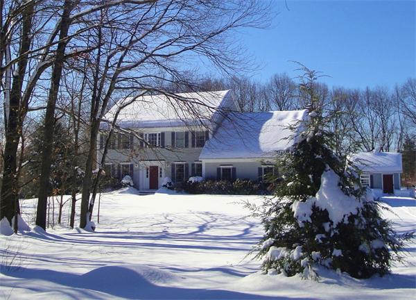 a view of a house with a snow in front of it