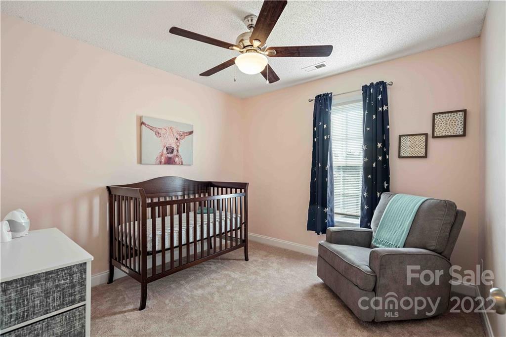 321 Dexter Place Monroe, NC 28110 - Photo 11 of 17 a bedroom with furniture and a window
