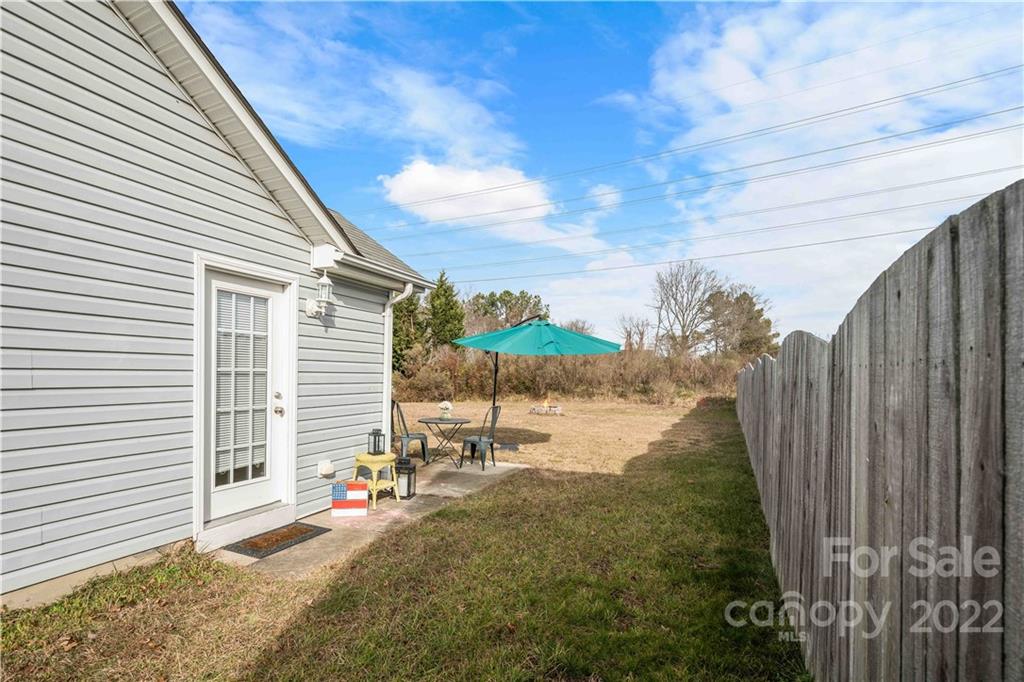 321 Dexter Place Monroe, NC 28110 - Photo 16 of 17 a view of a house with backyard and sitting area
