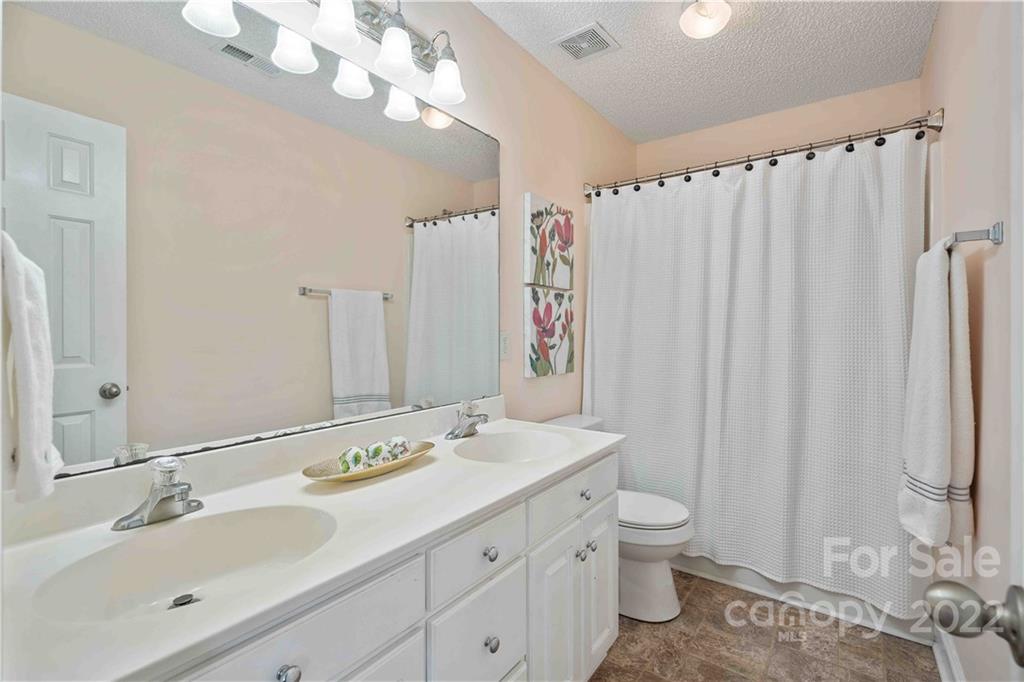 321 Dexter Place Monroe, NC 28110 - Photo 10 of 17 a bathroom with a double vanity sink mirror and toilet