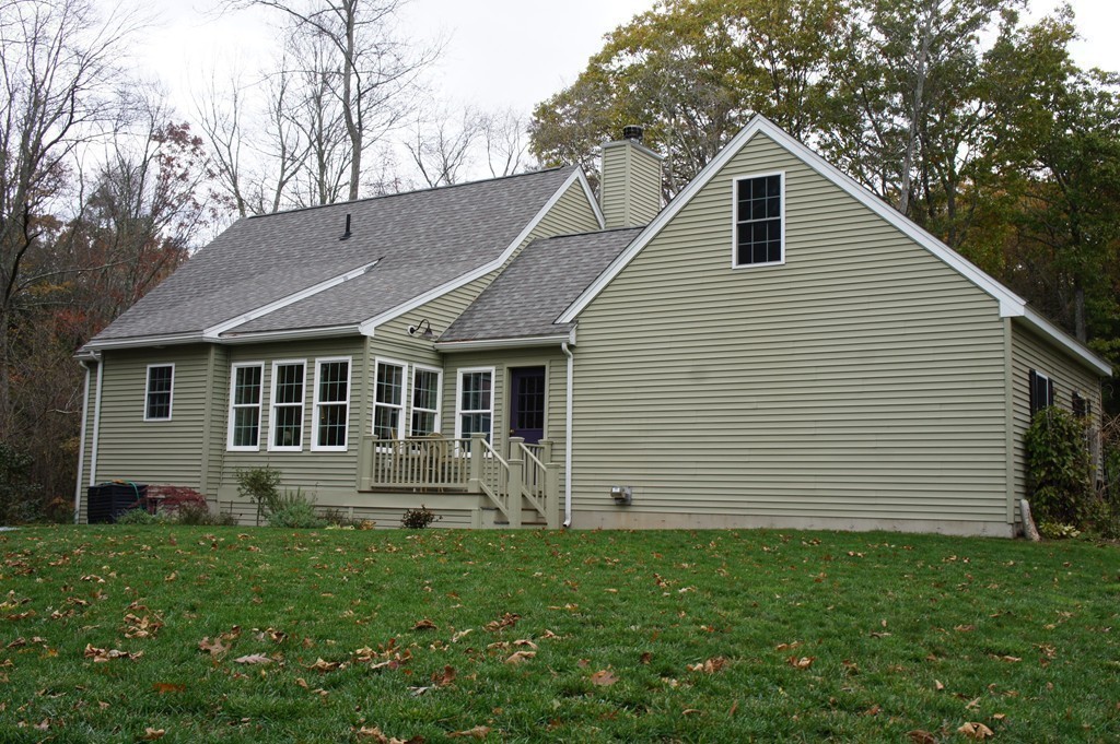 22 H Foote Road Charlton, MA 01507 - Photo 23 of 28 a front view of a house with a yard