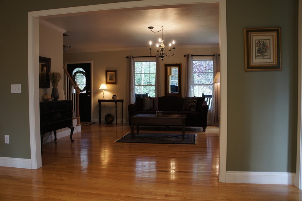 22 H Foote Road Charlton, MA 01507 - Photo 7 of 28 a living room with furniture and a chandelier