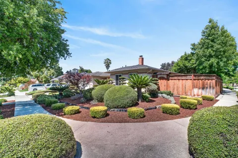 an aerial view of a house with a garden