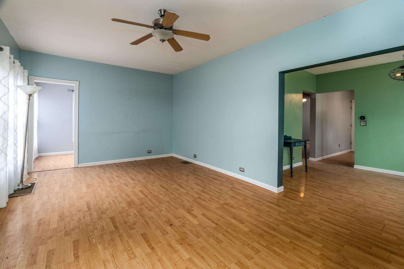 705 North Bridge Street Carbondale, IL 62901 - Photo 7 of 29 an empty room with wooden floor and windows