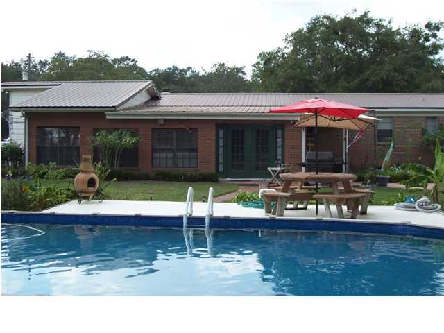 6023 Dairy Road Baker, FL 32531 - Photo 2 of 29 a view of a house with swimming pool and a yard