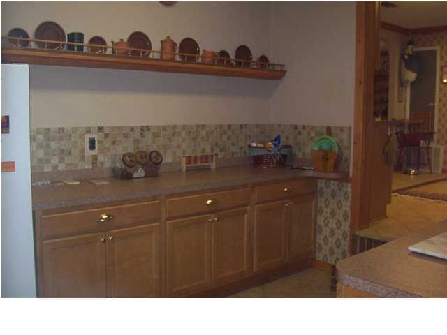 6023 Dairy Road Baker, FL 32531 - Photo 12 of 29 a kitchen with a sink and cabinets