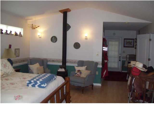 6023 Dairy Road Baker, FL 32531 - Photo 14 of 29 a living room with furniture and a chandelier