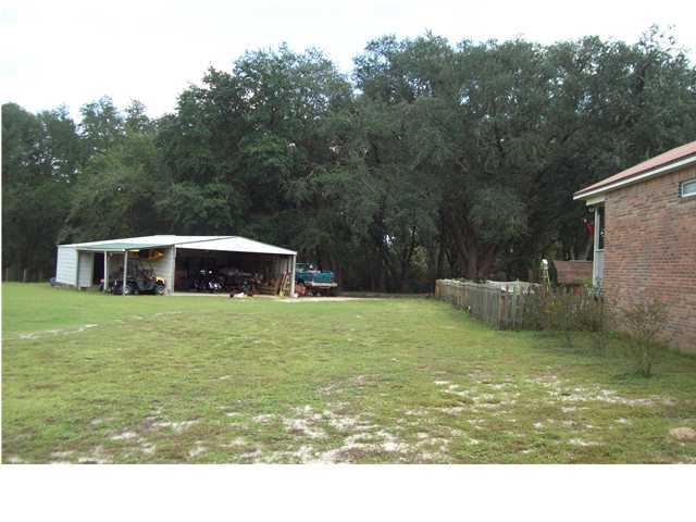 6023 Dairy Road Baker, FL 32531 - Photo 17 of 29 a house view with a swimming pool