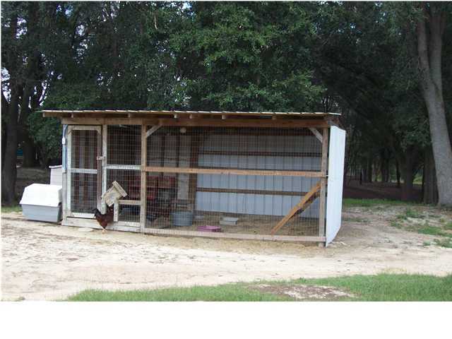 6023 Dairy Road Baker, FL 32531 - Photo 20 of 29 a view of a backyard