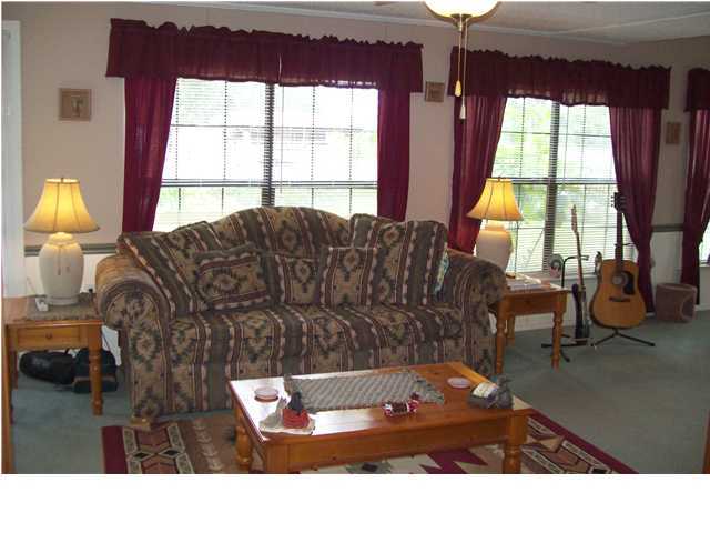 6023 Dairy Road Baker, FL 32531 - Photo 21 of 29 a living room with furniture and a large window