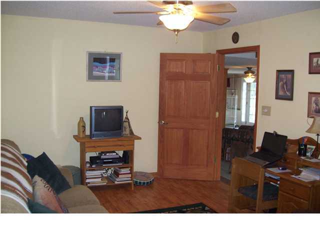 6023 Dairy Road Baker, FL 32531 - Photo 22 of 29 a living room with furniture and a flat screen tv