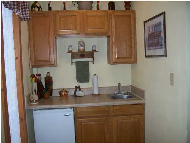 6023 Dairy Road Baker, FL 32531 - Photo 28 of 29 a kitchen with sink and cabinets