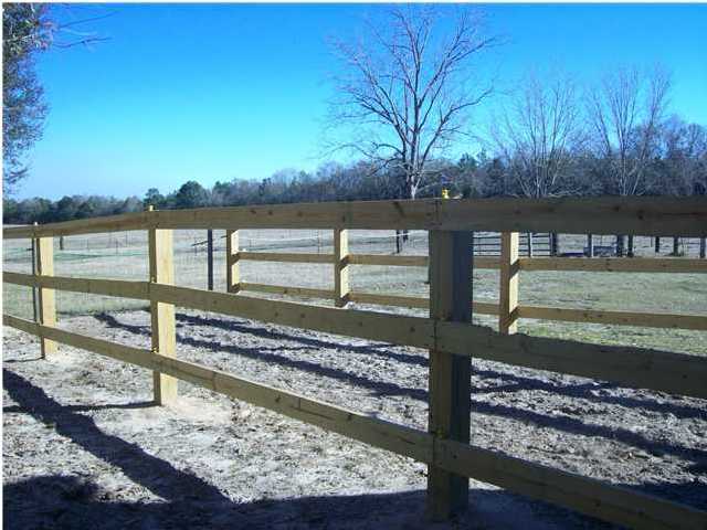 6023 Dairy Road Baker, FL 32531 - Photo 6 of 29 a view of a yard with wooden fence
