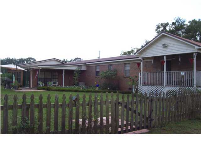 6023 Dairy Road Baker, FL 32531 - Photo 7 of 29 a view of a house with a black gate