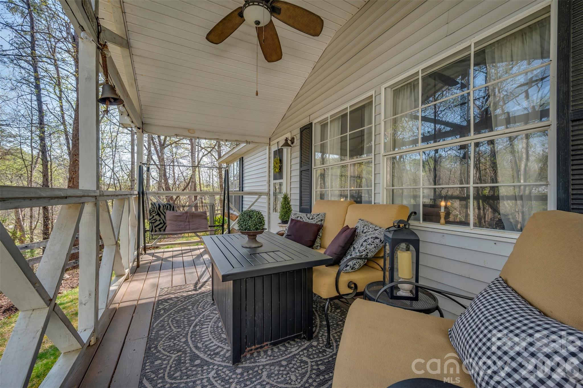 243 Buffalo Creek Road Lake Lure, NC 28746 - Photo 8 of 33 a view of a patio with table and chairs