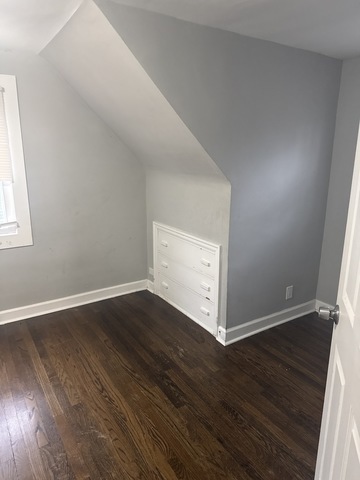 15818 St Louis Avenue Markham, IL 60428 - Photo 12 of 17 an empty room with wooden floor and windows