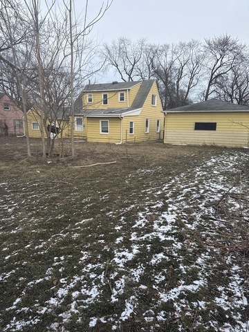 15818 St Louis Avenue Markham, IL 60428 - Photo 16 of 17 a view of a large white house with a yard