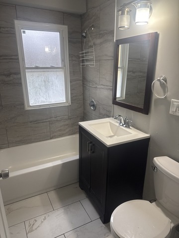 15818 St Louis Avenue Markham, IL 60428 - Photo 7 of 17 a bathroom with a sink toilet and shower