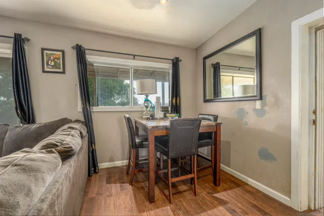 a view of a dining room with furniture window and outside view