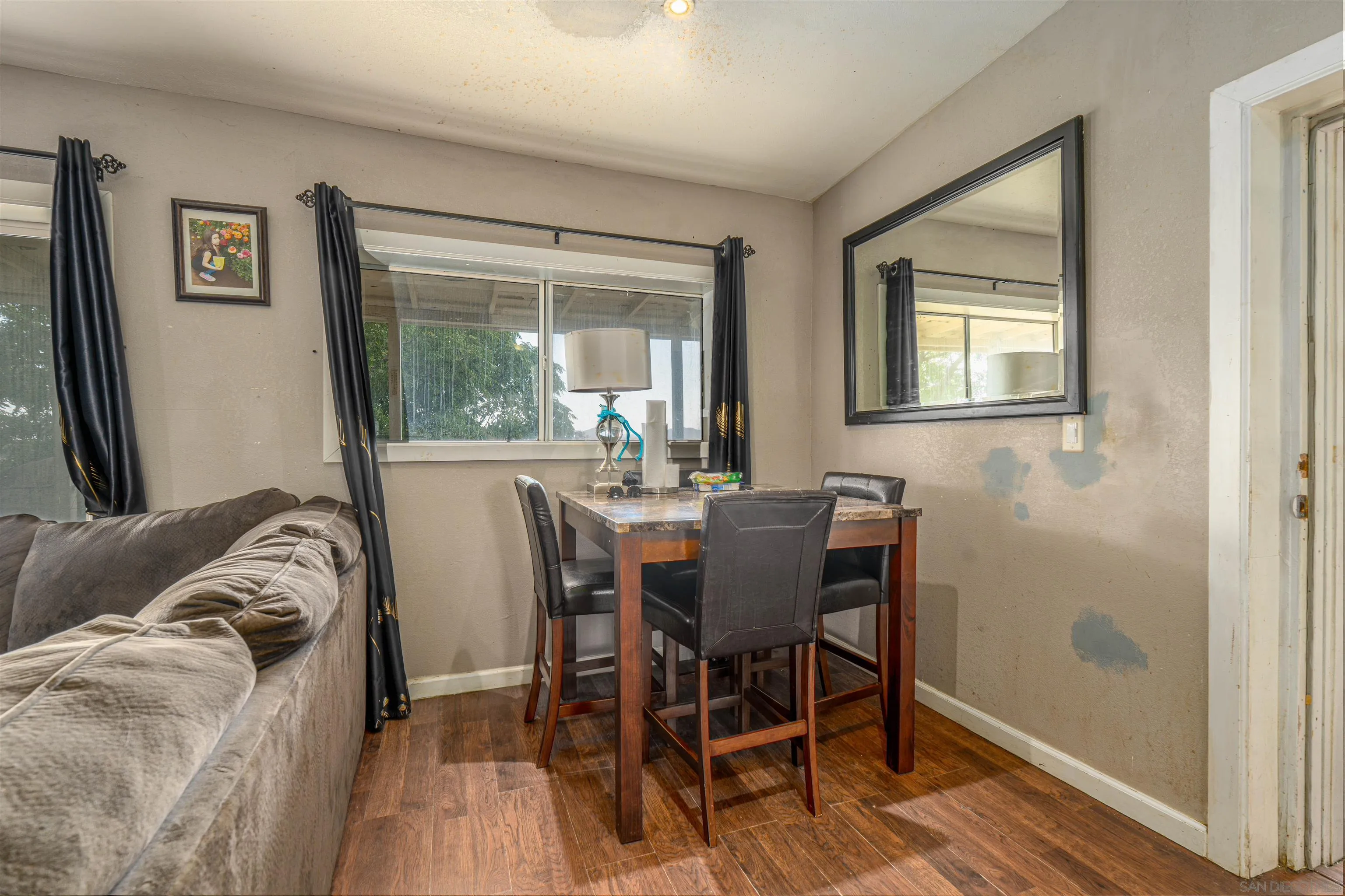 28587 Goetz Road Canyon Lake, CA 92587 - Photo 13 of 24 a view of a dining room with furniture window and outside view